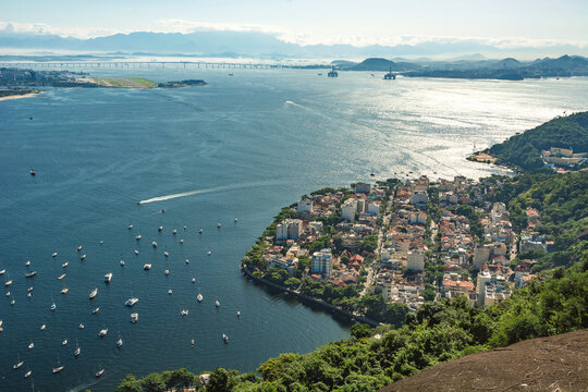 Rio de janeiro, Brazil. Aerial view of the Urca neighborhood close to the mountain and Guanabara Bay. In the background, Santos Dumont airport and the Rio Niter&oacute;i bridge.