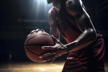 Fotobehang close-up of basketball player dribbling the ball, ready to make a shot © Sergey