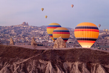 Hot air balloon flight in Goreme in Turkey during sunrise. Ride in a hot air balloon, the most...
