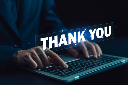businessman using a laptop and showing the message thank you on a display screen. concept of thank you business, appreciation and gratitude, congratulations, presentation from technology digital
