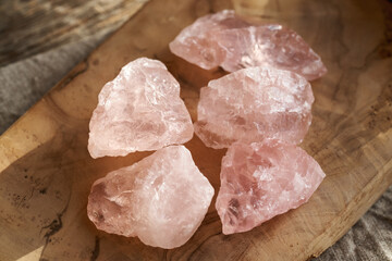 Rose quartz stones on a table, close up