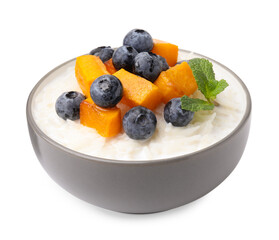 Delicious rice porridge with blueberries and pumpkin isolated on white
