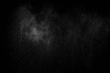 Texture dark pattern. Abstract splashes of water on black background. Freeze motion of white...