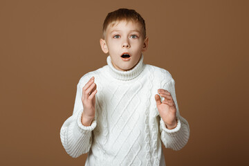 Portrait of shocked teen boy, amazed guy drop jaw and staring at camera at something awesome,...