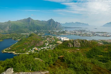 Fotobehang Panoramic view of town Svolvær on island Austvågøya, Lofoten islands, Nordland, Norway. Amazing nature with mountains and peaks, open sea, pier and bay. © Lizaveta