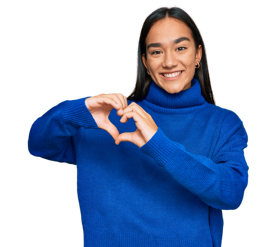 Young asian woman wearing casual winter sweater smiling in love showing heart symbol and shape with hands. romantic concept. - Powered by Adobe