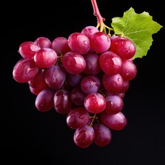 Fototapeta premium bunch of red grapes on a black background