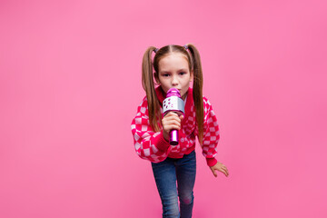 Photo of charming cute girl dressed stylish clothes announcing advertisement telling news isolated on pink color background
