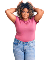 Young african american plus size woman wearing casual clothes doing bunny ears gesture with hands palms looking cynical and skeptical. easter rabbit concept. - obrazy, fototapety, plakaty