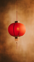 Chinese red lanterna hanging on a light gold background. 