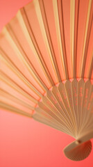 Chinese  fan on peach color background in the style of minimalism