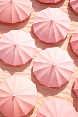 Flat lay of pink sun umbrellas on a sandy beach.Pastel colors.Pattern.Minimal concept. 