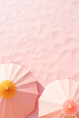Flat lay of two sun umbrellas on the beach with pink sand.Minimal concept.Pastel color.