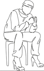 man sitting on a chair in women's shoes