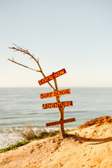 Sign of possibilities at Falesia beach in Algarve, Portugal
