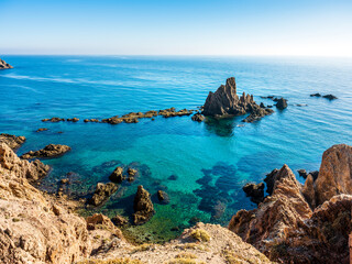 Beautiful Gata Cape landscape with rock formations in the water during sunset in Andalucia, Spain