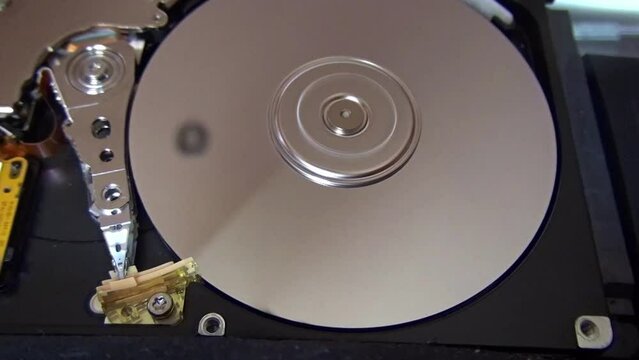 Serial Ata hard disk under repair. Hdd inside flat view, spindle, actuator arm, read write head, platter, etc. 