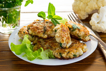 cooked vegetarian fried cauliflower cutlets in a plate