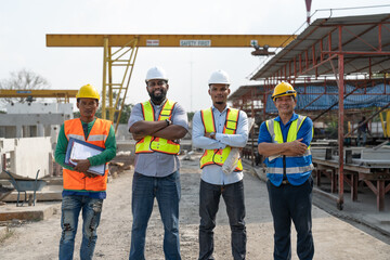 Group of diverse teamwork civil engineers foreman and workers wear safety vests with helmets standing and crossed arm at construction site factory produce precast concrete - Powered by Adobe