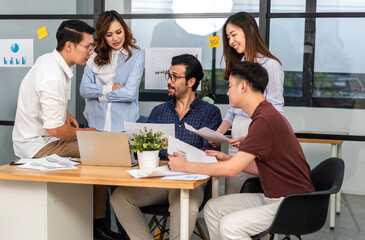 Group of creative asian business meeting and discussing strategy startup project analysis finance process.Success asian business people work plan and brainstorm marketing idea in office.Teamwork