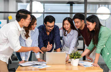 Group of creative asian business meeting and discussing strategy startup project analysis finance process.Success asian business people work plan and brainstorm marketing idea in office.Teamwork