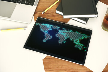 Top view of modern digital tablet display with abstract graphic world map, big data and networking concept. 3D Rendering