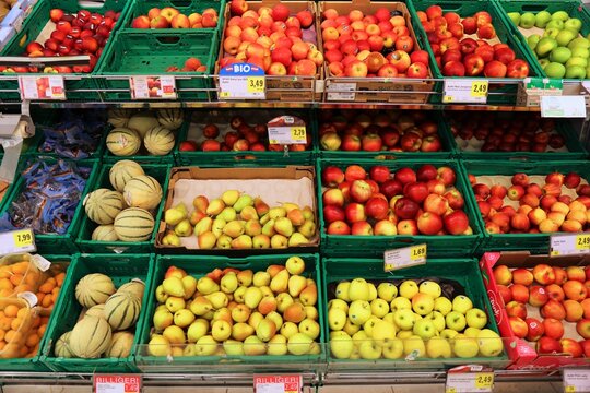 VIENNA, AUSTRIA - AUGUST 4, 2022: People visit fruit section in Spar supermarket in Austria. Spar is a large supermarket chain originating from the Netherlands.