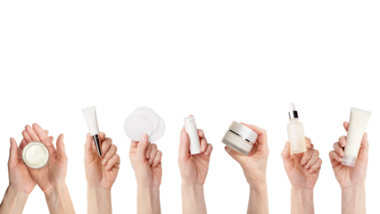 Female caucasian hands hold beauty skin care products on transparent background with copy-space