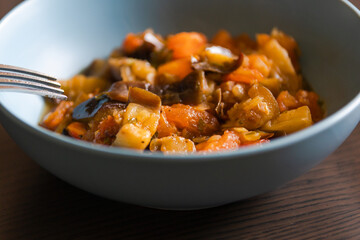 Soulful Comfort: Eggplant Stew in Blue Bowl Close-Up