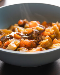 Soulful Comfort: Eggplant Stew in Blue Bowl Close-Up