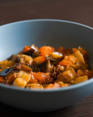 Soulful Comfort: Eggplant Stew in Blue Bowl Close-Up