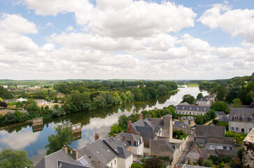 Castle in the city of Amboise France, beautiful architecture, old roofs, Loire river, green trees and colorful flowers.