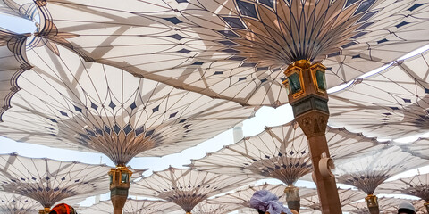 MEDINA, SAUDI ARABIA - APRIL 28 2018: These Umbrella construction on the square of Al-Masjid...