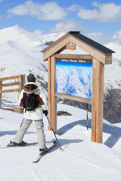 VALLOIRE, FRANCE - MARCH 24, 2015: Skier analyzes ski map in Galibier-Thabor station in France. The station is located in Valmeinier and Valloire and has 150km of ski runs.