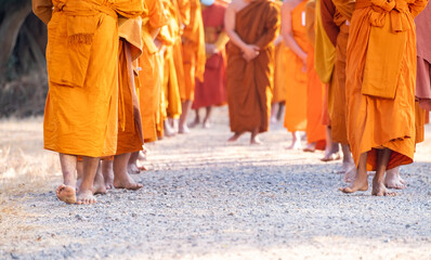 Monks walking for meditation, practicing religious physical exercises, performing religious...