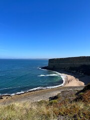 Fototapeta na wymiar Ocean coast, clear blue sky, blue horizon, natural colors, no people