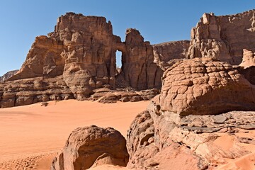 Fototapeta premium View of Tamezguida cathedrale rock formation in Tadrart Rouge rocky mountain range in Tassili n Ajjer National Park. Sahara desert, Algeria, Africa.