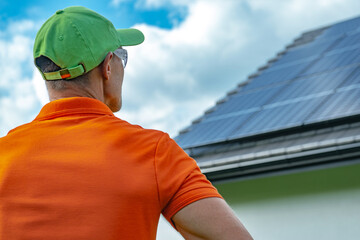 Solar Panels Installer Taking Last Final Look on a Newly Installed Photovoltaic