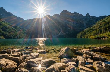 Beautiful, colorful mountain lake with an azure surface and mountain peaks with beautiful sunlight. Morskie Oko - Eye of the Sea - Tatry - Tatra Mountains, Sun reflections - obrazy, fototapety, plakaty