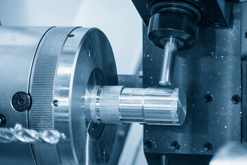 The CNC lathe machine milling the metal shaft parts by milling spindle.
