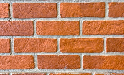 The floor is a small rectangular brown brick wall. The surface is rough and hard. brick wall background abstract background.