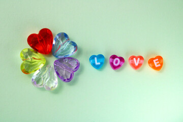 Hearts of different colors with transparency and the word love
