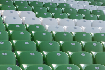 Obraz premium plastic green and white seats on football stadium