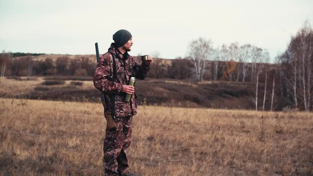 The hunter loads the shotgun on the hunt