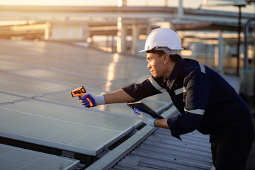 Electrical engineer inspects solar panel installation in power station Renewable energy technology...