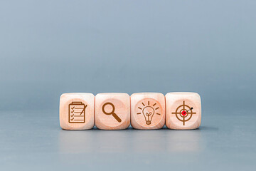 Wood cube block stacking with icon. business strategy and action plan Concept. isolated on gray...