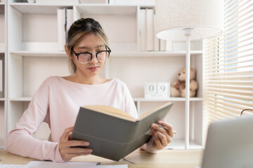 Woman reading book, Student reading a book in a private office, Self study, Textbooks from books,...