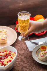 Sparkling champagne in glasses on the table, salad in appetizer tartlets