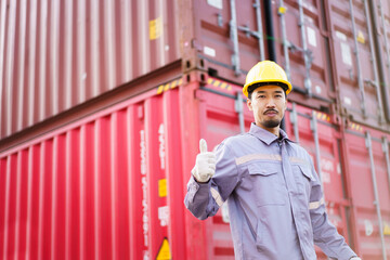 Asian male logistic worker in safety workwear portrait at the container yard. Logistic foreman portrait.