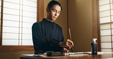 Calligraphy, ink and traditional Japanese man with paper for letters, notes and text for documents...